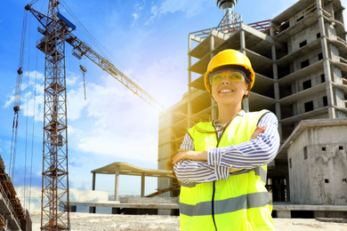 Professional engineer in safety equipment at construction site