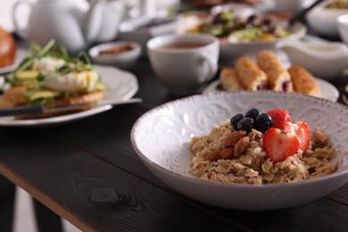 Oatmeal with fruits and nuts served on buffet table for brunch