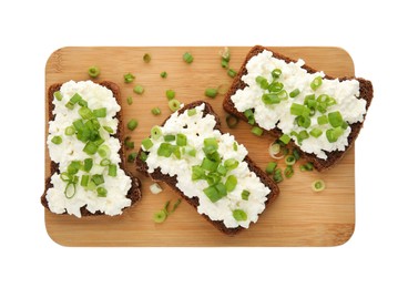 Photo of Bread with cottage cheese and green onion on white background, top view