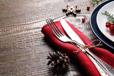 Beautiful Christmas table setting on wooden background, closeup