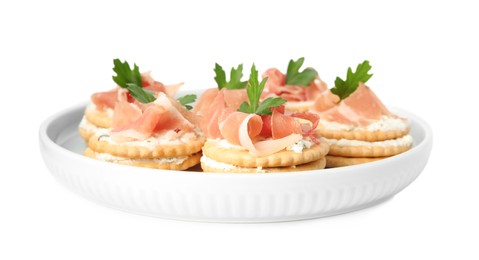 Delicious crackers with cream cheese, prosciutto and parsley on white background