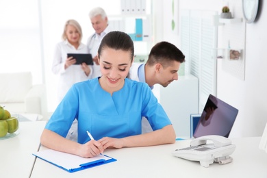 Young female receptionist working in hospital