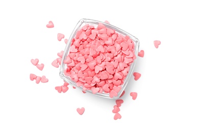 Sweet candy hearts in bowl on white background, top view