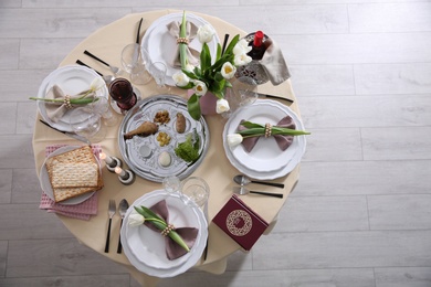 Festive Passover table setting with Torah, top view. Pesach celebration