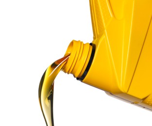 Pouring motor oil from yellow container on white background, closeup