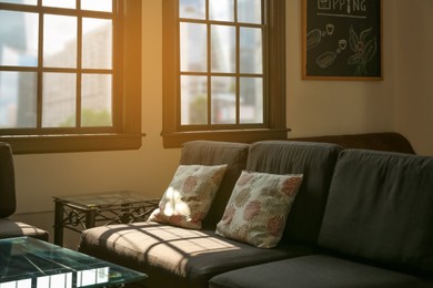 Photo of Cozy cafe interior with sofa and table