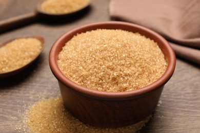 Brown sugar on wooden table, closeup view