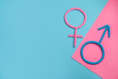 Photo of Gender equality. Male and female symbols with space for text on color background, flat lay