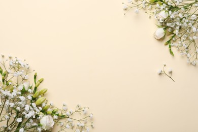 Beautiful floral composition with gypsophila on beige background, flat lay. Space for text