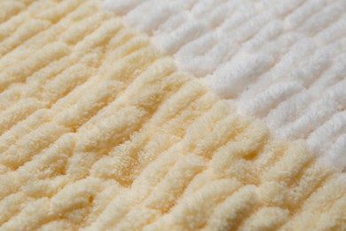 Texture of soft knitted fabric as background, closeup