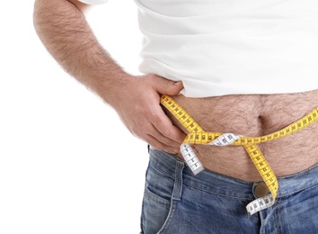 Overweight man with large belly and measuring tape isolated on white, closeup