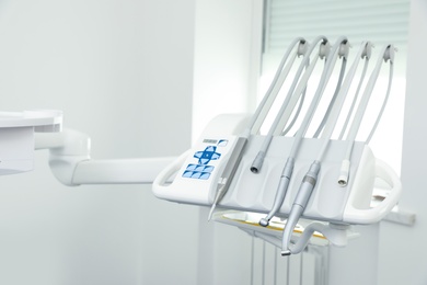 Set of professional equipment in dentist's office. Space for text