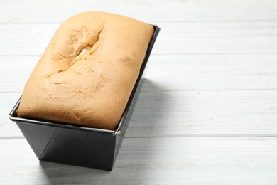 Photo of Tasty pear bread on white wooden table, closeup
 with space for text. Homemade cake