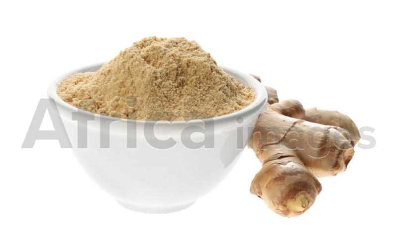Dry ginger powder in bowl and fresh root isolated on white