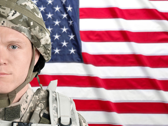 Male soldier and American flag on background, space for text. Military service