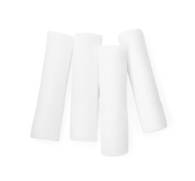 Medical bandage rolls on white background, top view