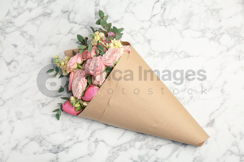 Photo of Bouquet of beautiful fragrant flowers on marble background