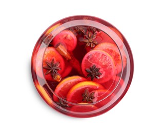 Glass bowl of delicious aromatic punch drink on white background, top view