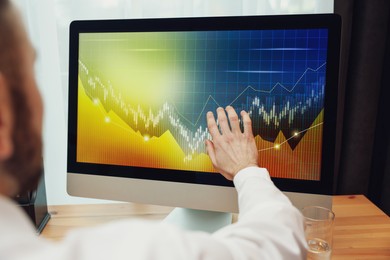 Broker working with computer in office, closeup. Forex trading
