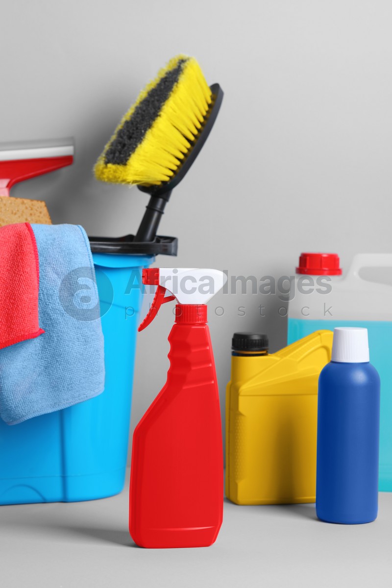 Different car products in bucket on white background