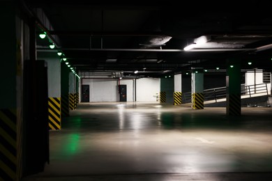 Photo of Empty modern car parking garage at night
