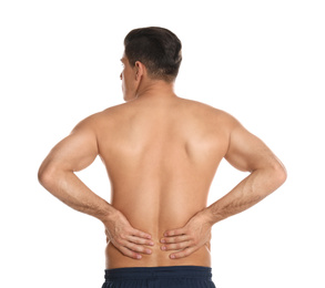 Man suffering from lower back pain on white background. Visiting orthopedist