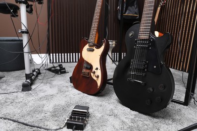 Electric guitars and pedal at recording studio. Music band practice