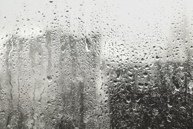 Blurred view of city from window on rainy day