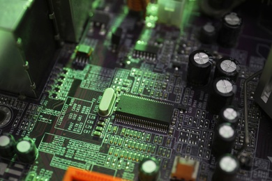 Computer motherboard as background, closeup. Electronic device