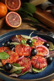 Plate of delicious sicilian orange salad on table, closeup. Space for text