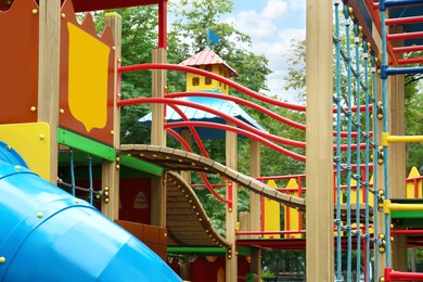 New colorful castle playhouse with climbing frame on children's playground