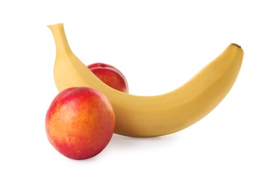 Banana and nectarines symbolizing male genitals on white background. Potency concept