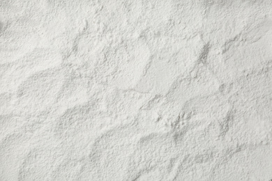 Pile of organic flour as background, top view