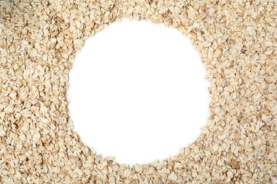 Frame of raw oatmeal on white background, top view. Space for text