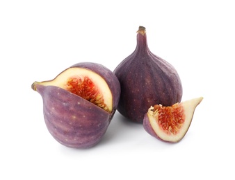 Whole and cut tasty fresh figs isolated on white