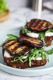 Delicious fresh eggplant sandwiches on plate, closeup