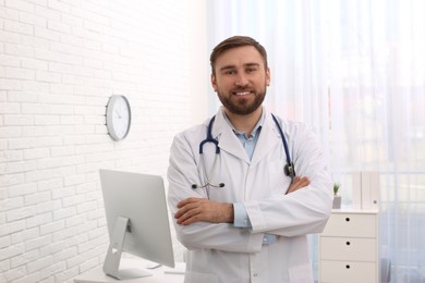 Portrait of pediatrician with stethoscope in clinic