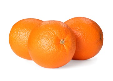 Tasty whole ripe oranges isolated on white