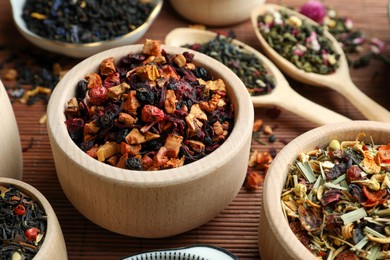 Photo of Many different herbal teas on bamboo mat