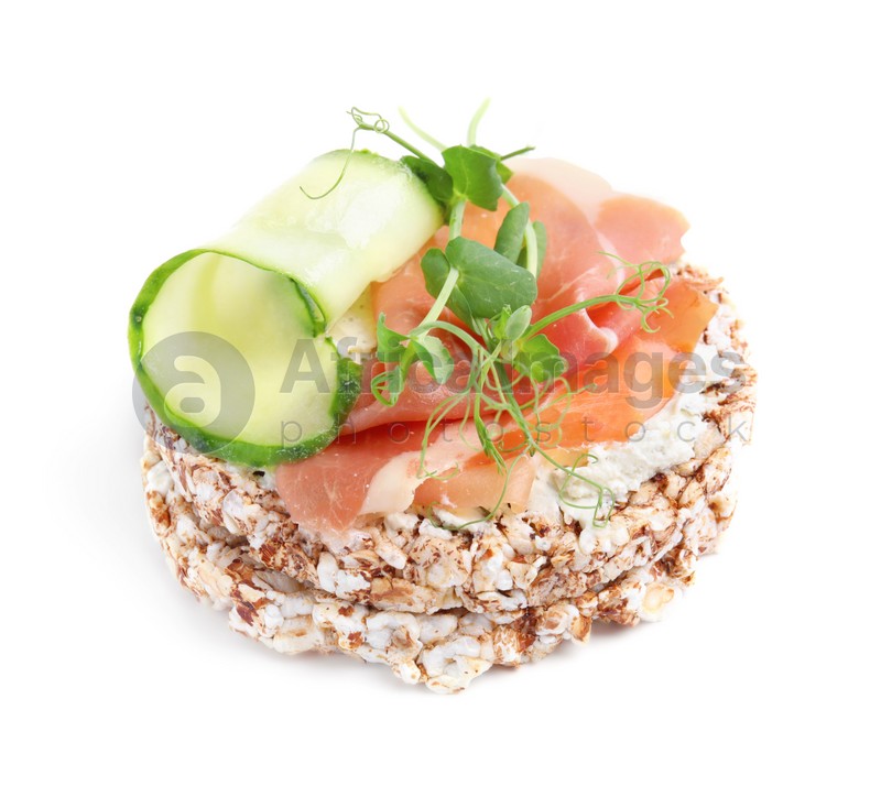 Crunchy buckwheat cakes with cream cheese, prosciutto and cucumber slice isolated on white