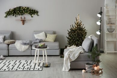 Stylish living room with Christmas decorations. Interior design