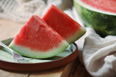 Sliced fresh juicy watermelon on wooden table, closeup