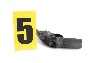 Gun and crime scene marker with number five isolated on white