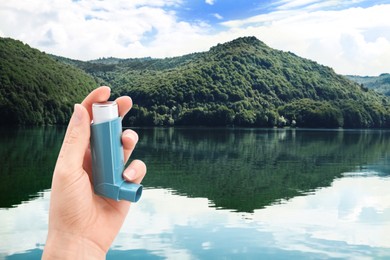 Image of Woman with asthma inhaler near lake, closeup. Emergency first aid during outdoor recreation