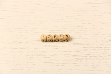 Word Forex with cubes on white wooden table