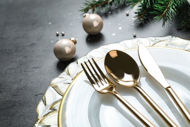Christmas table setting on grey background, closeup