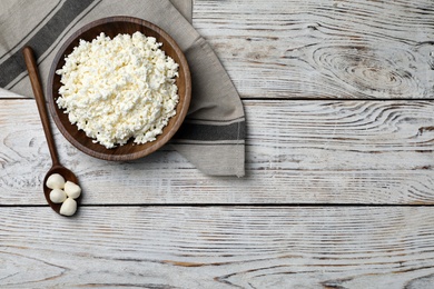 Cottage cheese and mozzarella on wooden background