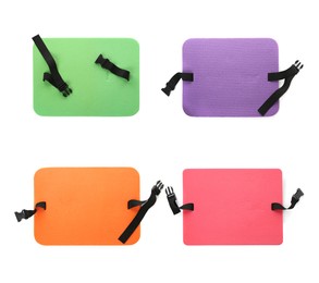 Set with colorful foam tourist seat mats on white background, top view