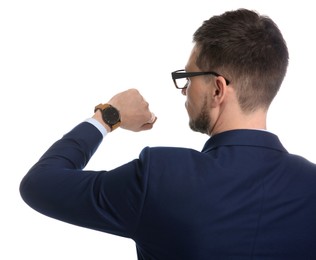 Businessman looking at wristwatch on white background. Time management