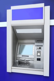 Modern color automated teller cash machine outdoors